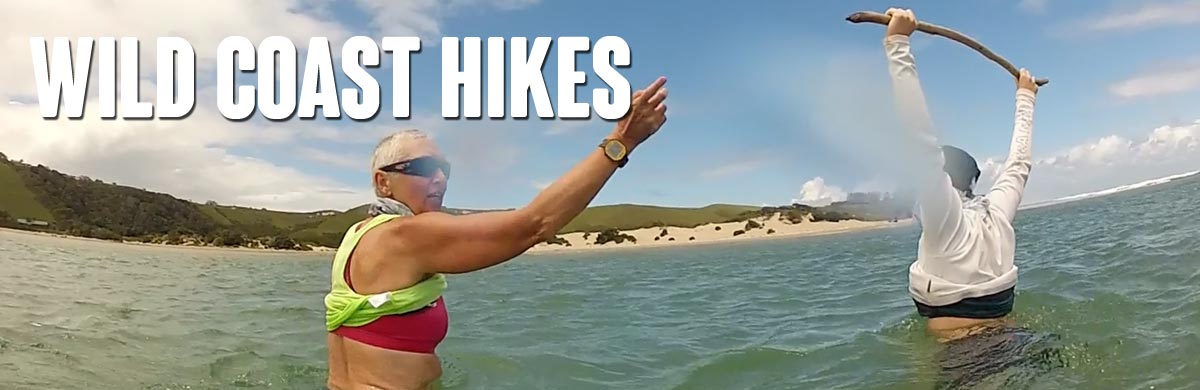 Wading across a river on the Wild Coast